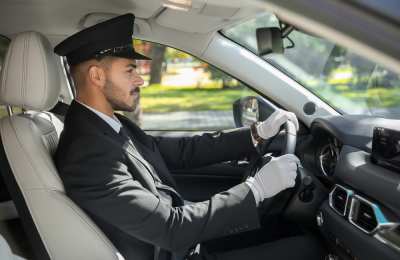 Young,Handsome,Driver,In,Luxury,Car.,Chauffeur, Service